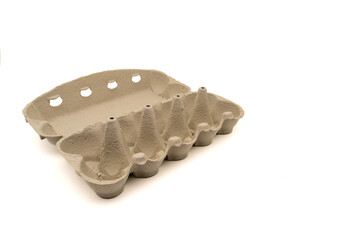 Wide open empty egg box for ten eggs, isolated on white with copy space. Carton pack, egg-container for packaging.