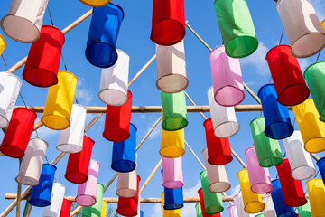 Decorated colorful lanterns hanging on a stand in the streets in Chiang Mai City, Thailand during...
