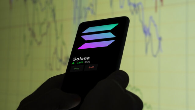 Investor analyzing the price of solana, the token coin $SOL Solana on a crypto exchange screen.