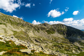 Mountain ridge with partly rocky mountain peaks in Retezat mountains in Romania