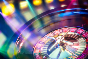 Moving casino roulette with colored lights in gaming room