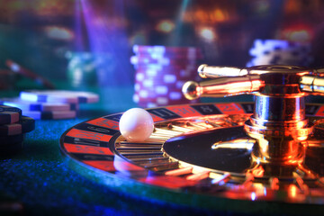 Detail of ball on casino roulette in dark gaming room