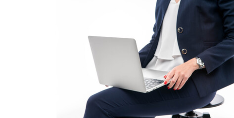 Portrait businesswoman holding silver laptop in the office isolated over white background