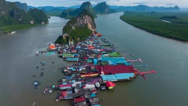 Hyperlape aerial drone view Koh Panyee island, a Famous Floating Village in Phang Nga Bay, Thailand