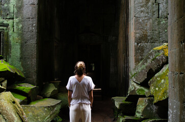 Unrecognizable European Tourist Woman Contemplating The Greatness Of The Ruins Of Angkor Wat In Ta...