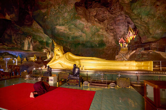 Phuket Thailand, May 29, 2023. Buddha temple built in a cave, images from inside.