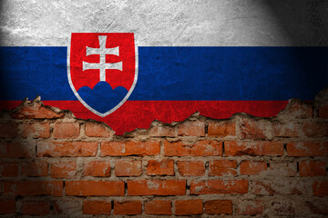 A wall with a painting of the slovakia flag at night