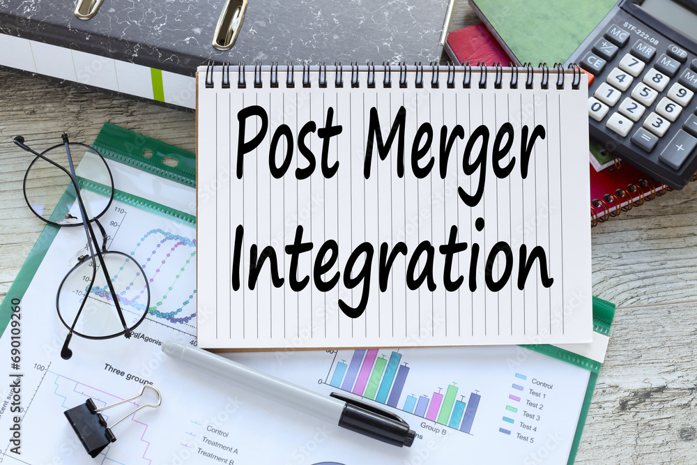 Poster post merger integration. financial charts and calculator. text on page