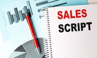 SALES SCRIPT text on a notebook with pen on a chart background