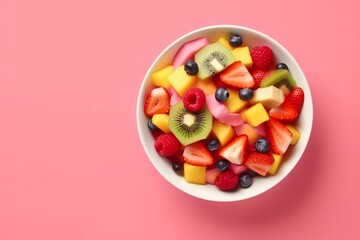 Bowl of healthy fresh fruit salad on pink background, top view. generative ai.