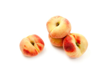 Several saturn peaches or flat peaches isolated on white background with clipping path..