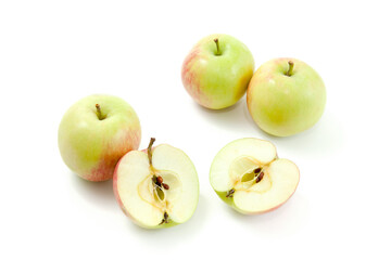 Half and whole of green apples isolated on white background with clipping path..