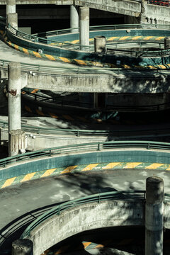 Abandoned parking lot reveals a hauntingly beautiful circular structure, a forgotten echo in an empty urban landscape