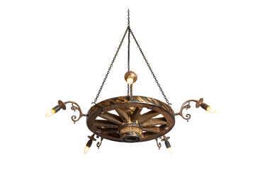 Decorative chandelier from a trolley wheel with chains and with concealed wiring. Rustic chandelier made from wood wagon wheel isolated on white.