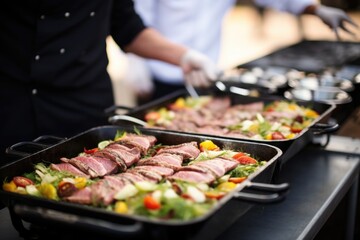 caterer organizing seared tuna steak dishes for an event - obrazy, fototapety, plakaty