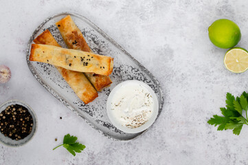 Turkish Cigara Börek (Sigara böreği) or Cigarette Pastry with Spinach and Feta Cheese with...