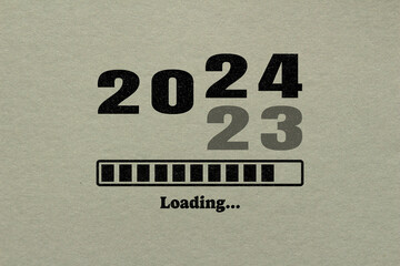 Loading 2024 symbol on paper. New year 2024 coming concept.	