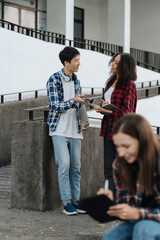 Education knowledge and university concept - group of students reading and preparing for exams on holiday.