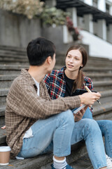 people, knowledge, education, literature and university concept - happy students reading books and preparing to exams university.