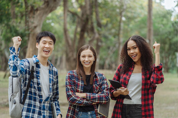 Happy group of college students feel excited overjoyed triumph with good news.