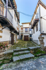 Street and traditional houses of the beautiful town of Candelario, in Salamanca.