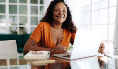 Work-life balance for seniors: Mature woman working from home