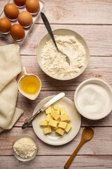 Baking background with cooking ingredients, butter, flour, eggs, sugar, oil. Vertical food photo