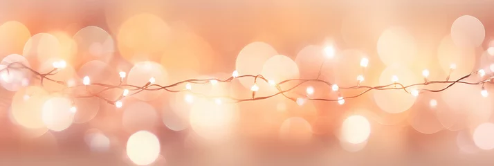 Fototapete Pantone 2024 Peach Fuzz beautiful Christmas lights garland with bokeh lights  in color of the year 2024 peach fuzz