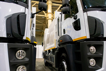 New white trucks with different cargo bases.