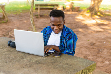 Young Student Engrossed in Laptop Learning