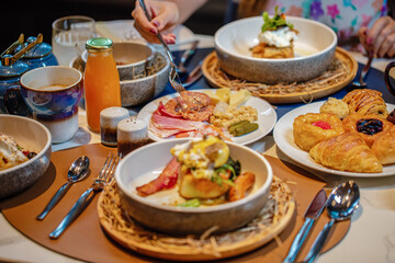 Gourmet brunch spread on table in restaurant. Dining and cuisine.