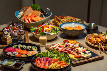 Assorted healthy seafood and vegetables spread on dining table. Gourmet and nutrition.