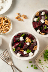 Beetroot salad with feta cheese and walnuts, top view, copy space