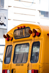 Bright yellow school bus on city street