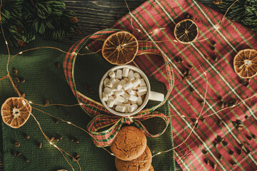 a mug with a Christmas pattern full of marshmallows. a Christmas card. cookies and slices of lemon and orange. festive drawing