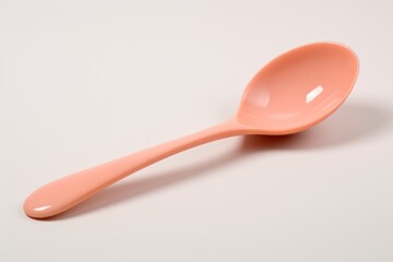Peach Fuzz Colored Spoon on Light Background, Soft Elegance