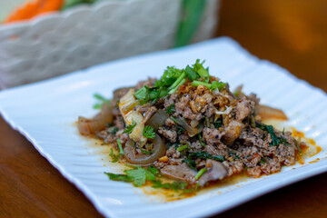 Northern Thai food, spicy minced pork salad (Larb Moo Kua)