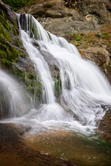 Big beautiful waterfall. Travel in Bulgaria. Hristovski waterfall. Vertical view