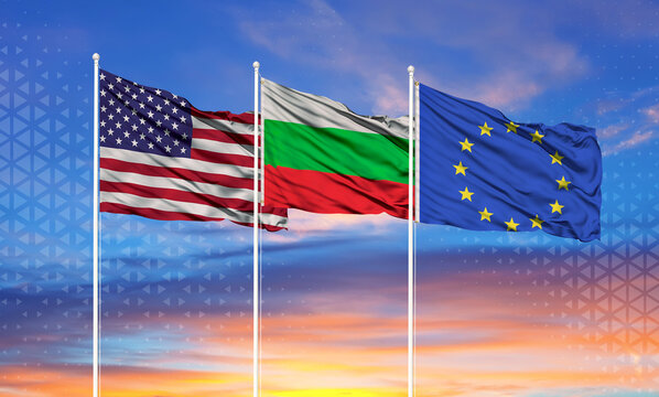 Three realistic flags of European Union, United States and Bulgaria on flagpoles and blue sky.