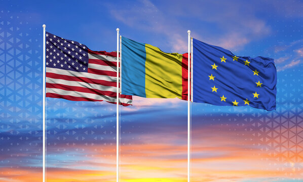 Three realistic flags of European Union, United States and Romania on flagpoles and blue sky