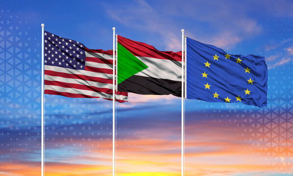 Three realistic flags of European Union, United States and Sudan on flagpoles and blue sky