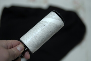 adhesive lint collector, adhesive lint collector that collects lint and dust on clothes,