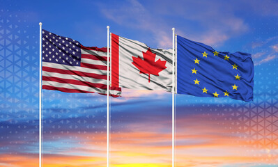 flags of European Union, United States and canada on flagpoles and blue sky