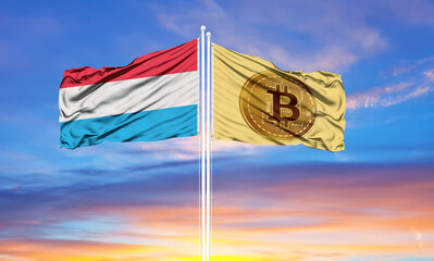 Bitcoin and Luxembourg two flags on flagpoles and blue sky.