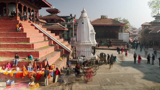 Time lapse of temples in Durbar Square, Kathmandu, Nepal in the morning with people passing by