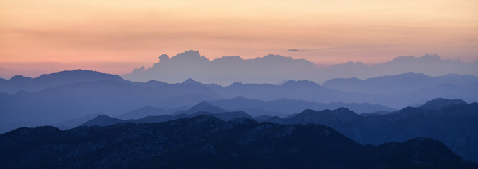 The Lights of the Setting Sun over the Mountain Range