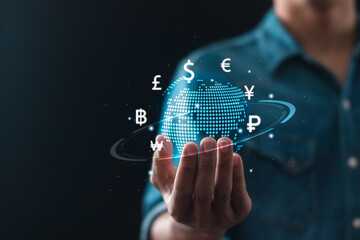 Online banking interbank payment concept. Businessman holding global icon with virtual currency symbols for money transfers and currency exchanges between countries of world.