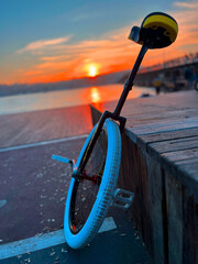 unicycle at the sea side with beautiful sunset © Yasin