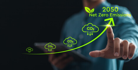 Net zero emissions by 2050. Businessman touching climate growth arrow to change climate and net...