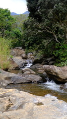 Fototapeta na wymiar Waterfall and rocks landscape view